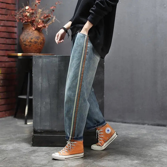 Calça Jeans com Patchwork e Listra Lateral Artística